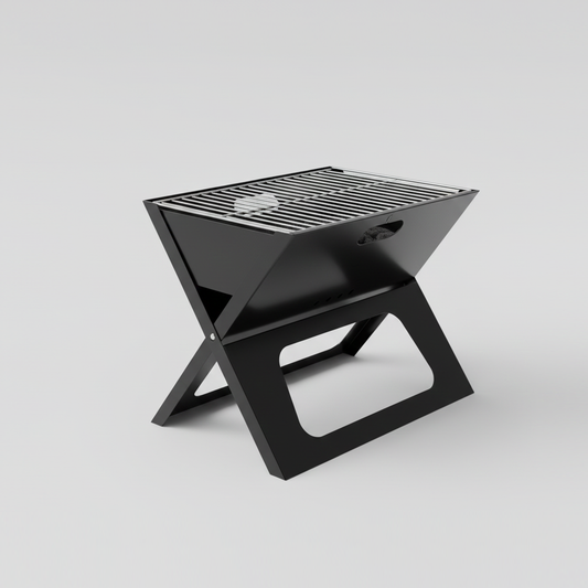 Parrilla a carbón portátil plegable. Diseño compacto tipo maletín.